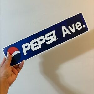 Pepsi Ave Sign in Blue and White